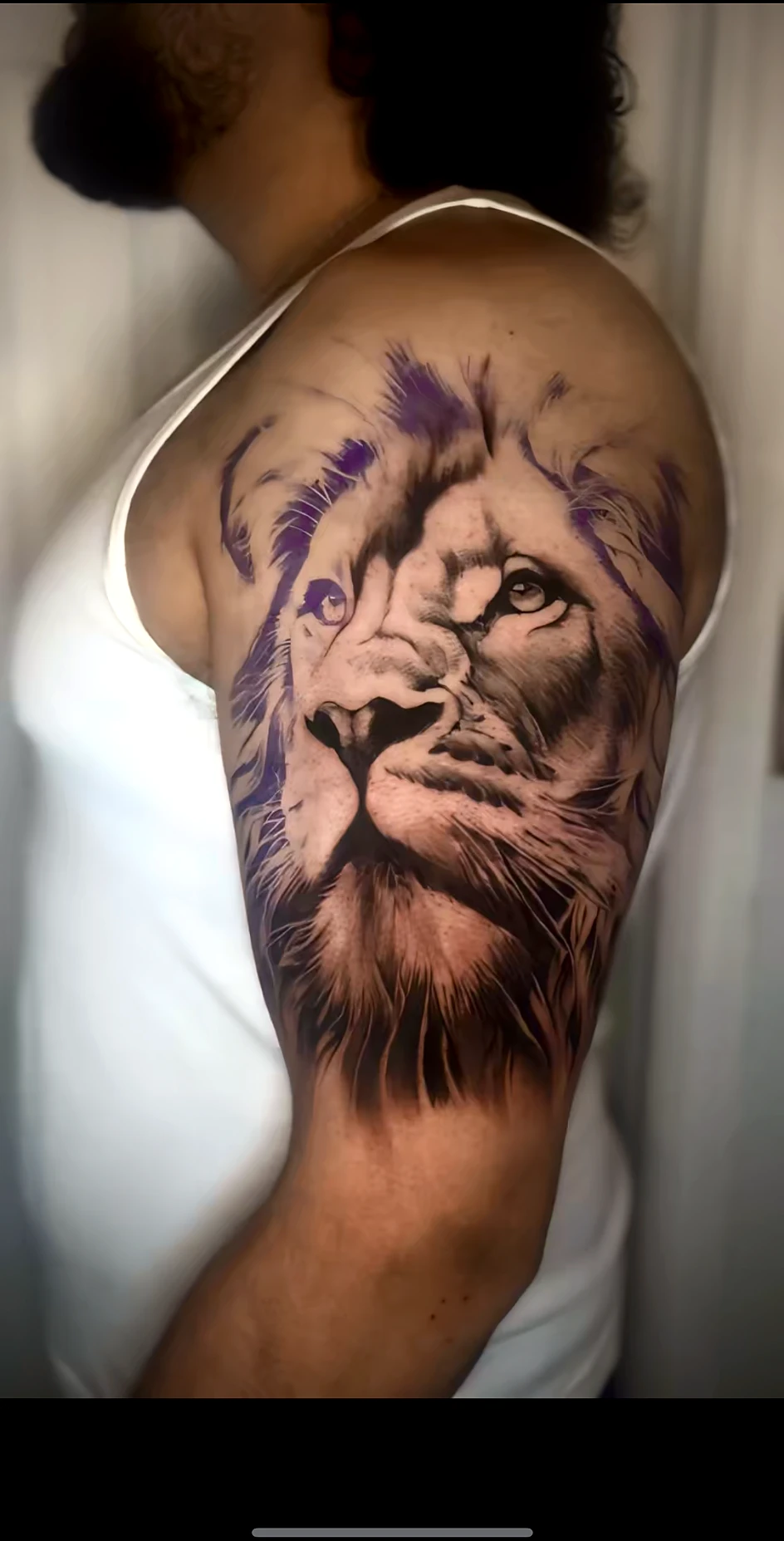 Black and grey realism lion on the shoulder by Rav Singh at Inkology