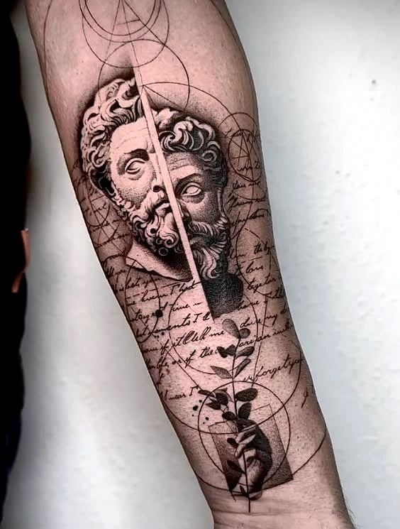 Black and grey realism split statue with script on the forearm by Rav Singh at Inkology