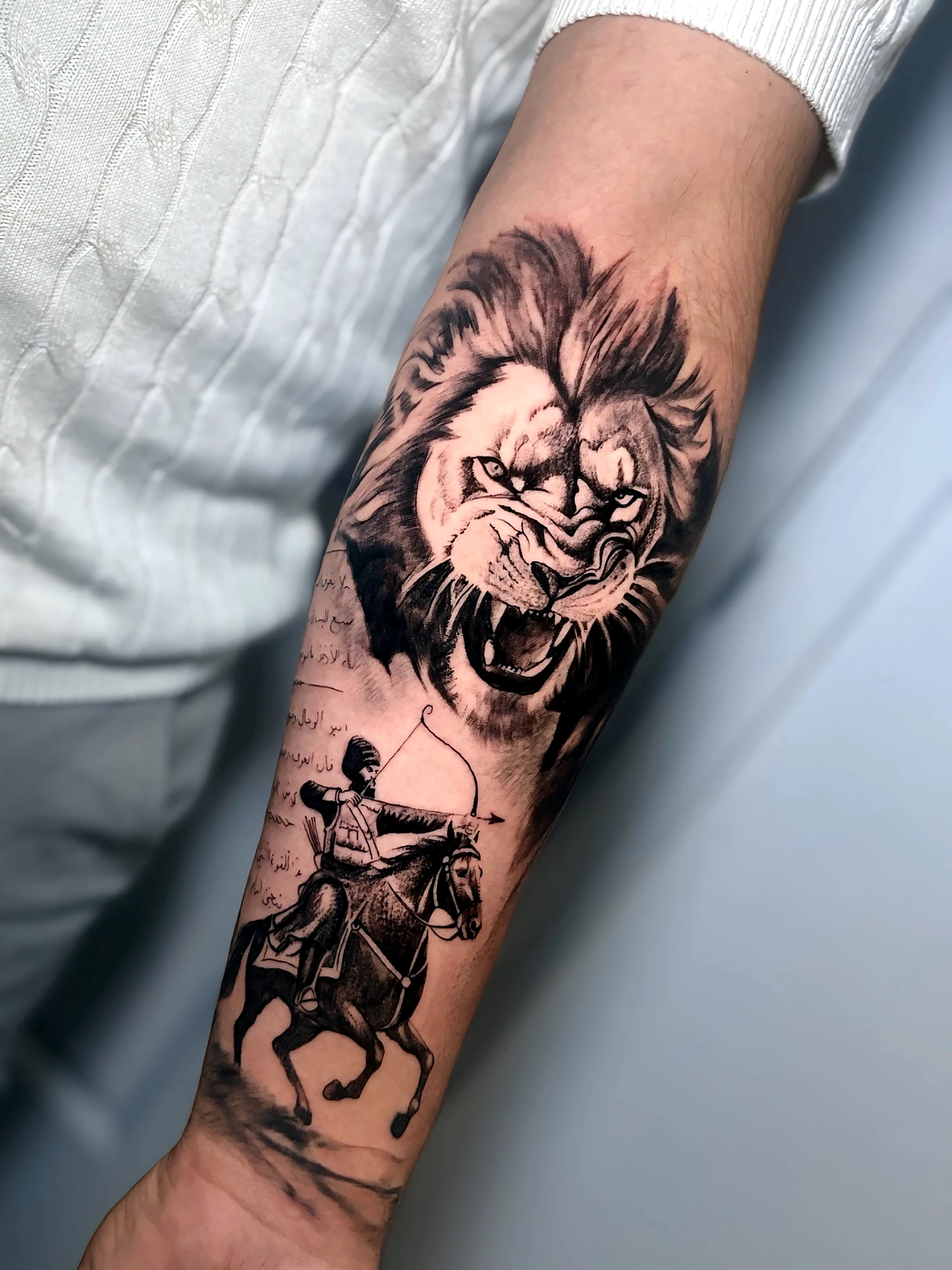 Black and grey realism lion, horse and warrior composition by Rav Singh at Inkology