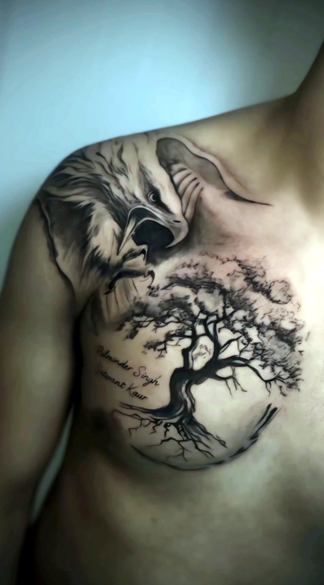 Black and grey realism eagle and tree chest piece by Rav Singh at Inkology