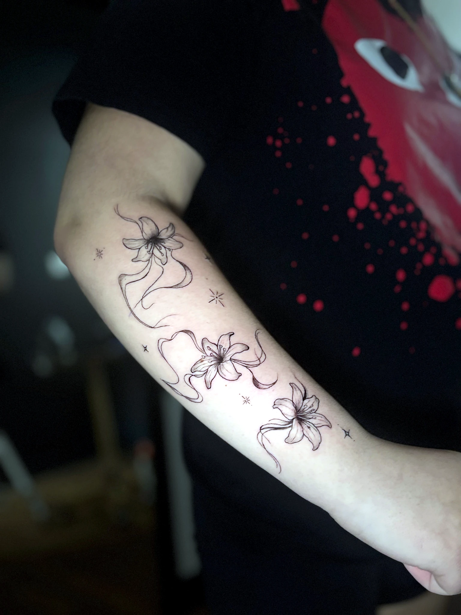 Fine line floral tattoo by Rav Singh at Inkology