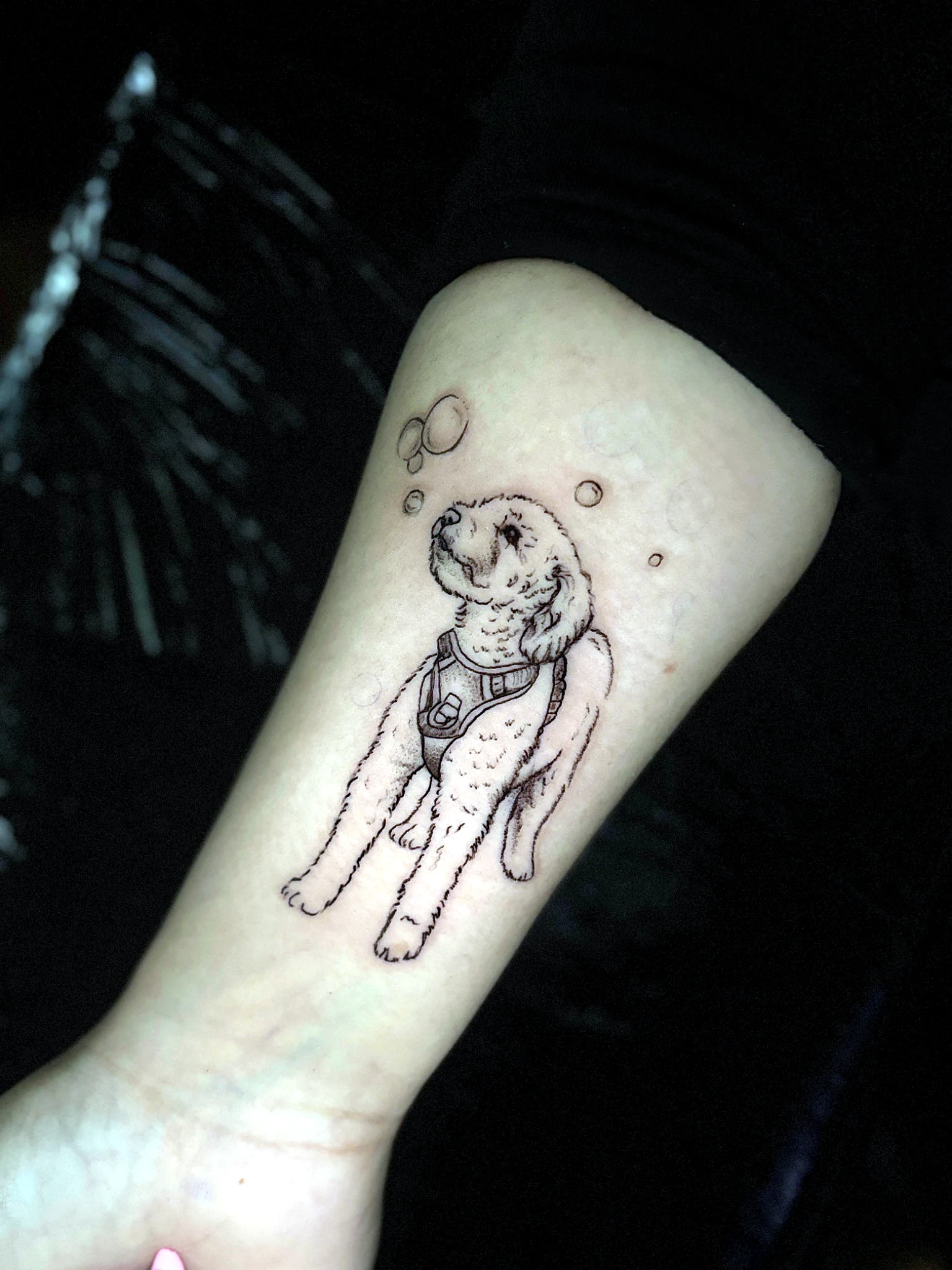 Fine line small dog tattoo by Rav Singh at Inkology